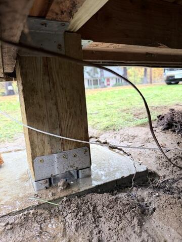 Helical Piers Secured to Home