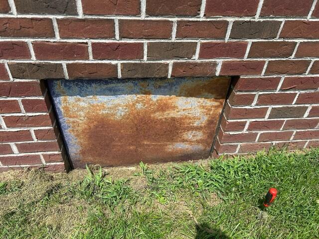 Rusted Crawl Space Door