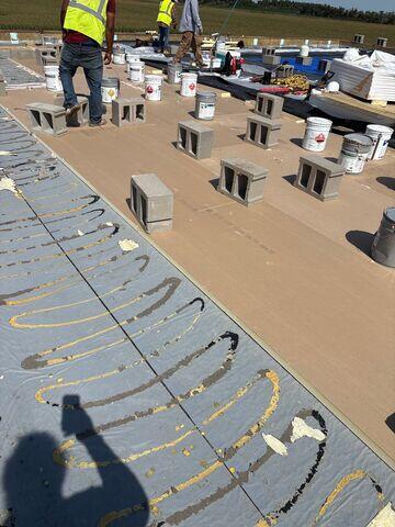 Underlayment adhesive applied