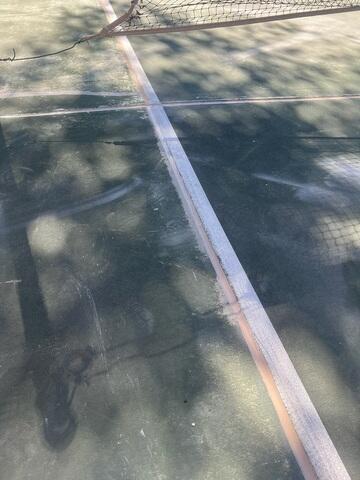 Close-Up of Repaired Crack on Concrete Court in Fallbrook CA