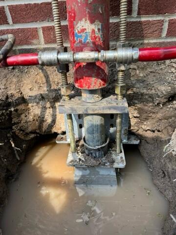 Our crew installed push piers to stabilize and lift the foundation to level.