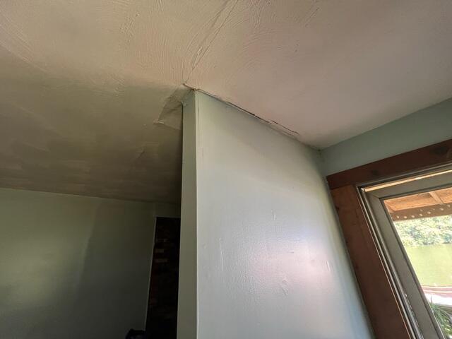 Upon inspection, we found additional symptoms of severe foundation settling and shifting, like these cracks along the ceiling.