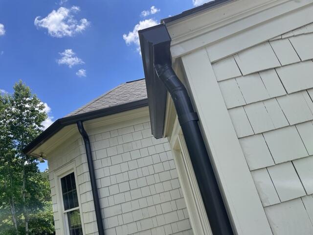 Custom black gutters installed