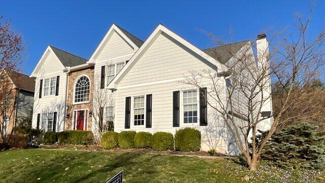 New siding, windows, gutters, and shutters