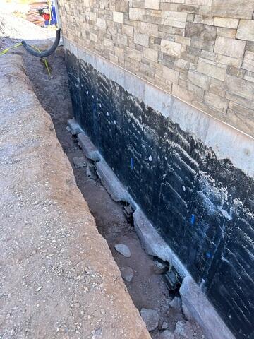 Steel Pier Bracket Installed Beneath Foundation Footing in Utah