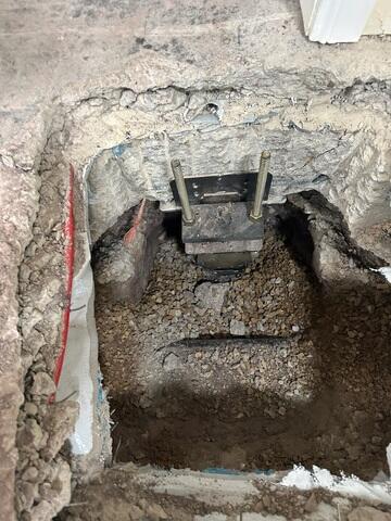 Steel Pier Bracket Installed Beneath Foundation Footing in Utah