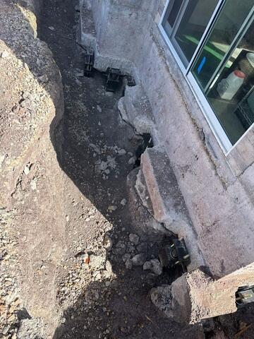 Pier Brackets Installed Beneath Settled Foundation in Utah