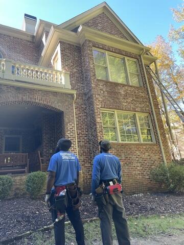 Inspecting the surrounding area for gutter replacement