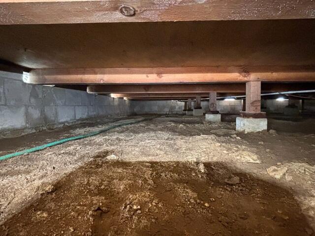 Moisture-Prone Crawl Space Before Encapsulation System Installation