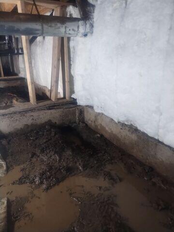 Muddy, wet crawl space