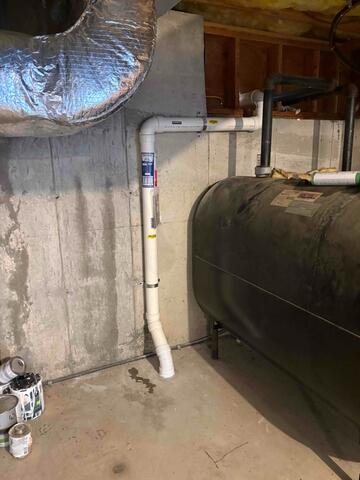 Interior Radon Mitigation System Installed in Unfinished Basement