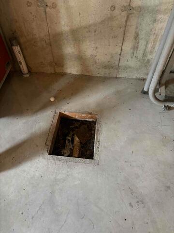 Existing Sump Pump Area Prior to Sealing Improvements