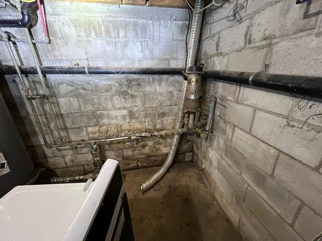 A damp basement with drainage problems and water-damaged walls