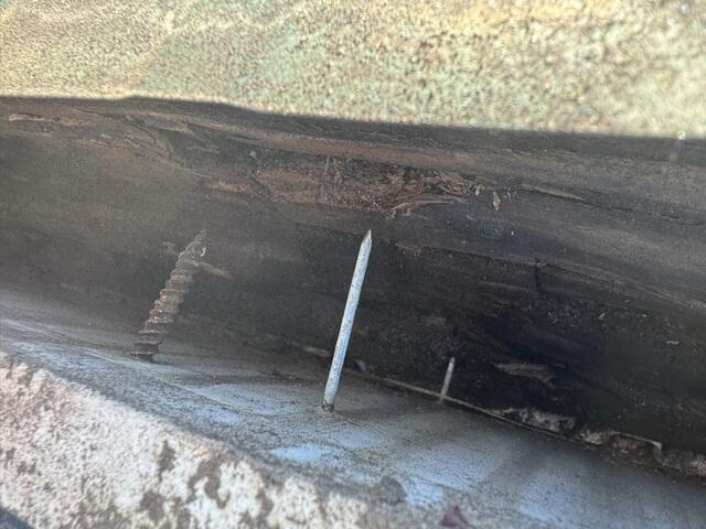 Another example of damage to the home's fascia and gutter pulling off.