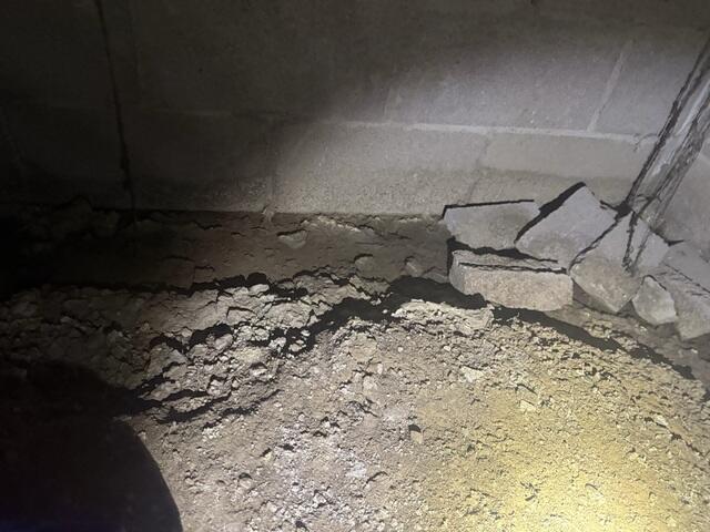 Evidence of Standing Water on the Concrete Block Wall of the Crawl Space