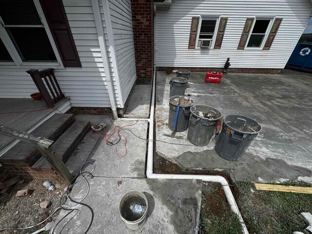 Exterior Drainage Line Installation to Redirect Water Away from the Foundation