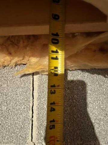 Measuring distance of bowing wall crack to the top of the floor joist