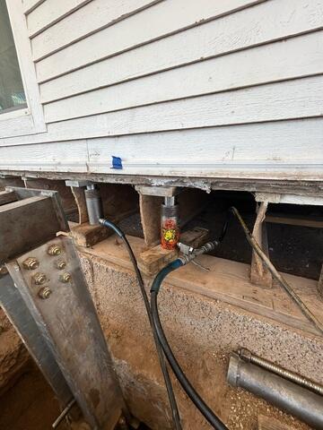 Hydraulic Lift Preparation During Foundation Pier Installation