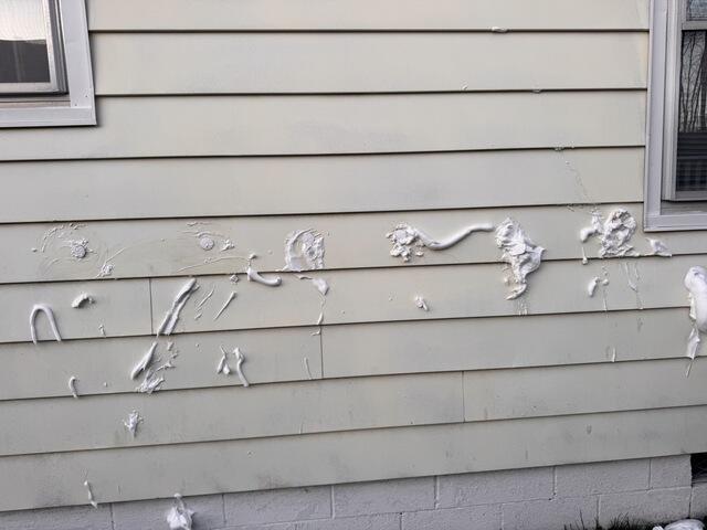 Aluminum sided home getting Injection Foam Insulation