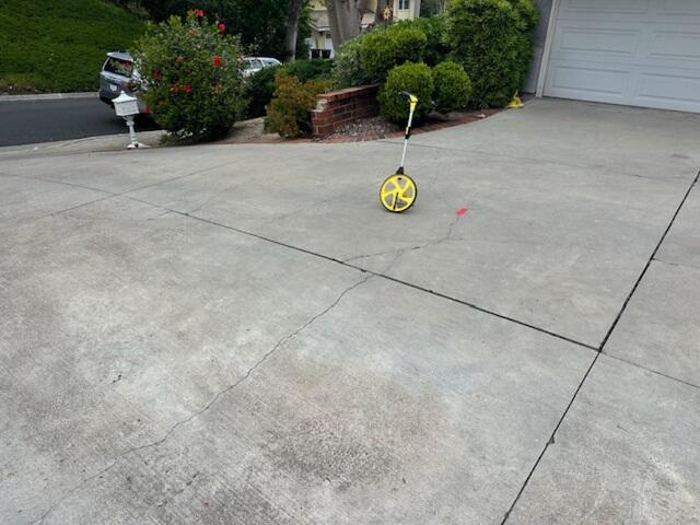 Driveway Cracks Marked Before Concrete Repair