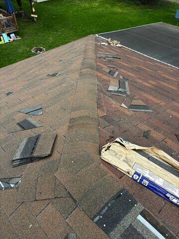 Shingles being torn off