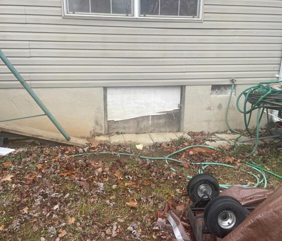 Before photo: Bad crawl space entry