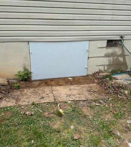 Crawl space access door installed by Fortress