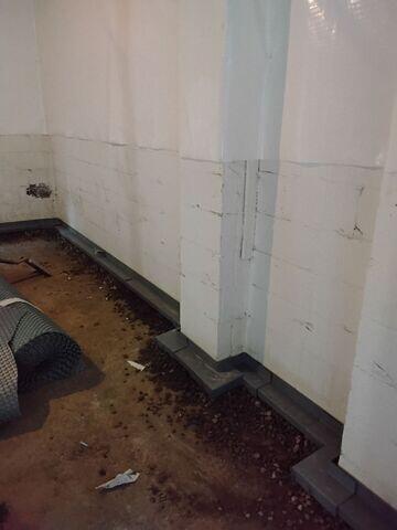 Photo 4: Interior Drainage System Gets Installed