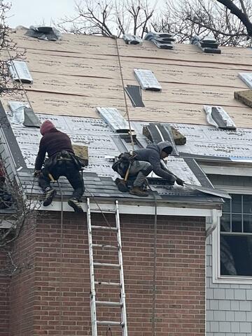 Careful Shingle Installation by Hand