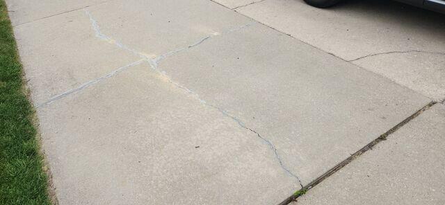 Cracked and Uneven Concrete Driveway