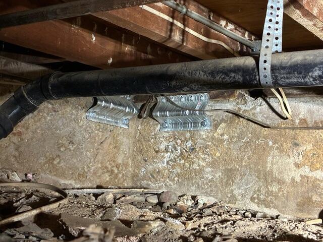 Engineered Seismic Brackets Installed Along Foundation Wall