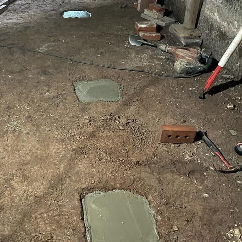 We poured a cast-in-place concrete footing to provide extra support for the new foundation system and to distribute better the home's weight.