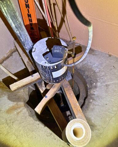 An Inventive Way To Keep A Sump Pump In Place