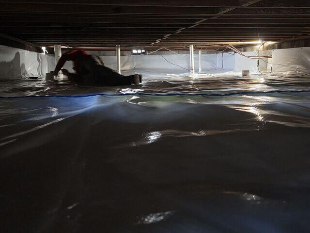 Sealing Crawl Space with Moisture Barrier