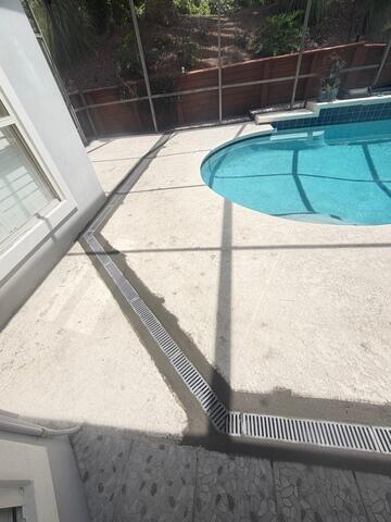 New Channel Drain Installed Around the Pool Deck