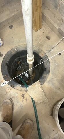 Basement's Outdated Sump Pump System Before Repairs