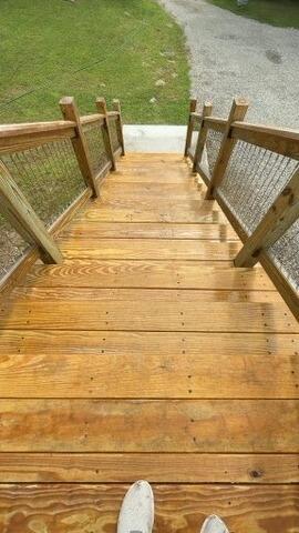 Refinished deck staircase featuring a fresh, protective semi-transparent sealer for maximum durability.