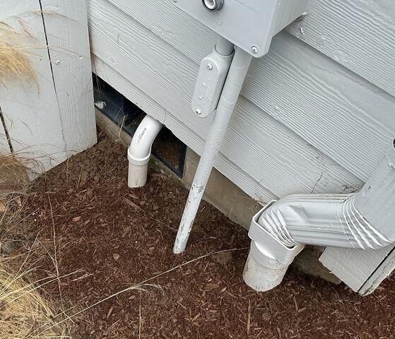 Sump Pump Drain Line Tied Into Existing Gutter Rain Drain Line
