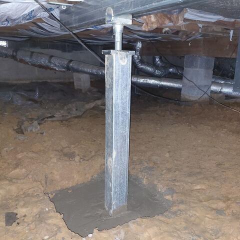 To stabilize the floor structure, we added SmartJacks and a supplemental steel beam. This beam would further reinforce the damaged joists and restore level floors throughout the living room. No more tripping!