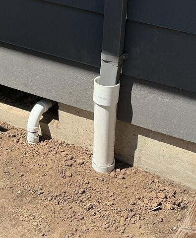 Sump Pump Discharge Connected to Existing Gutter Downspout Drain Line
