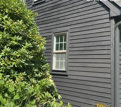Smooth, fully prepped, and freshly painted wood siding with a clean modern finish.