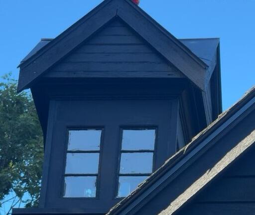 Restored architectural details and cupola window trim built to withstand the elements.