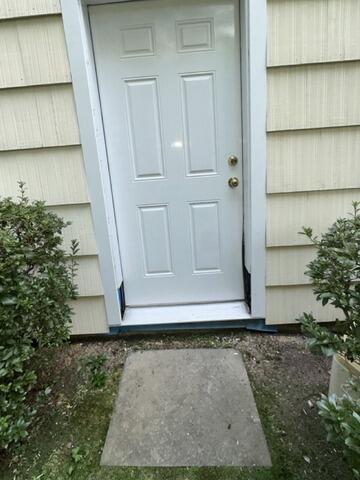 Cleanly repaired and recaulked exterior door frame, completely prepped for fresh topcoats.