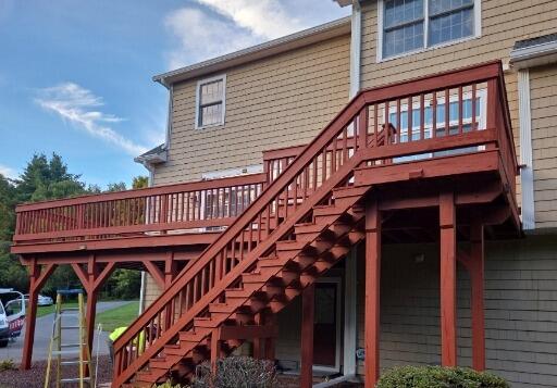 Complete refinishing of high-elevation deck support posts, stairs, and railings to restore curb appeal.