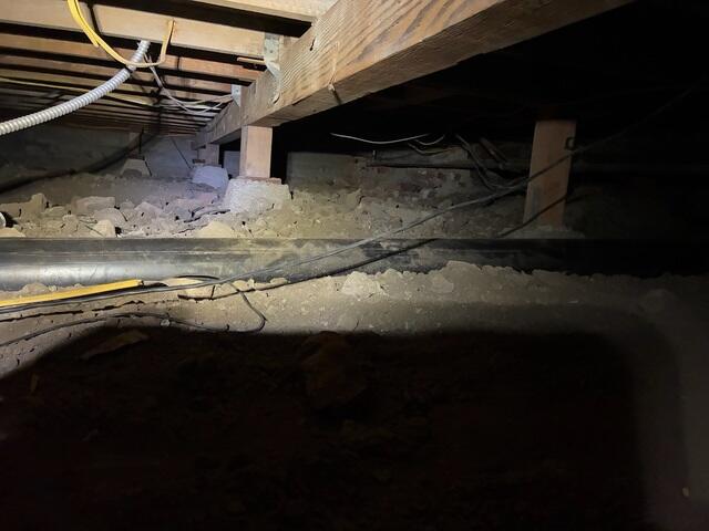 Exposed Soil Before Crawl Space Encapsulation