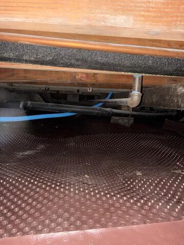 Crawl Space Floor Covered During Vapor Barrier Installation