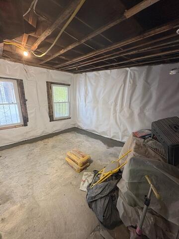 Basement Drainage System Cemented into Foundation Floor