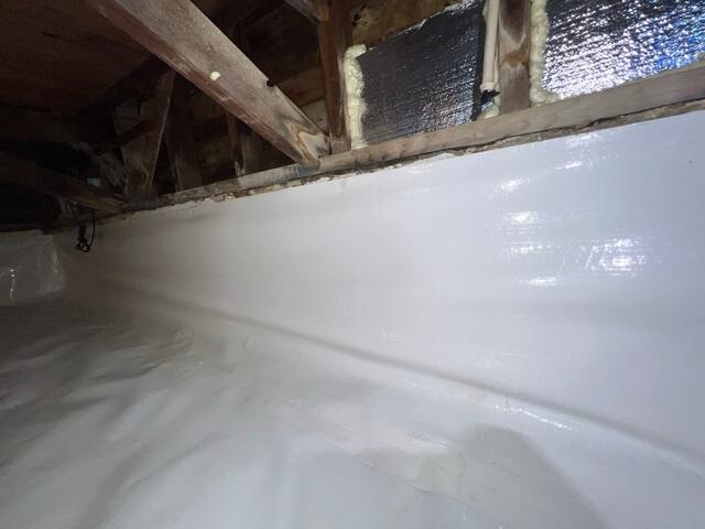 Vapor Barrier Installation at Crawlspace Corner