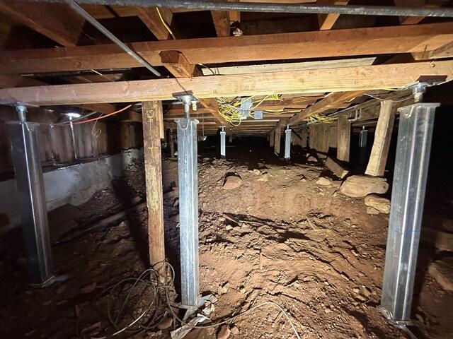 SmartJack Supports Installed Beneath Wooden Beams