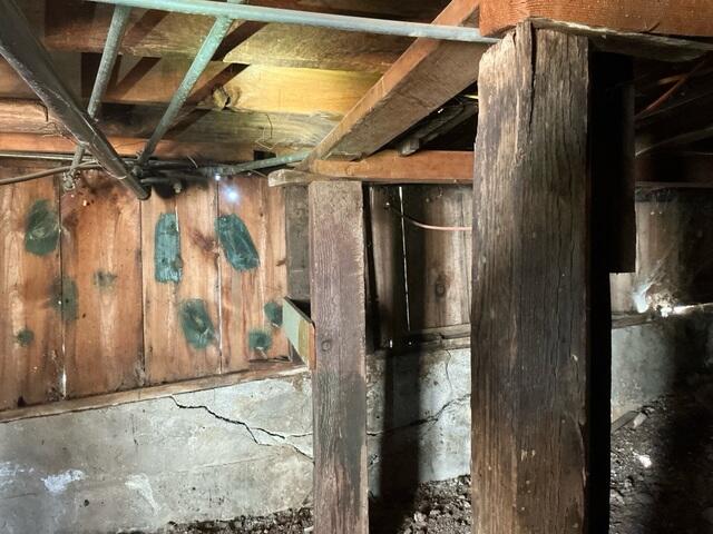 Wooden Support Posts and Foundation Wall Cracks